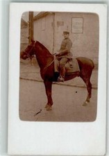 39803386 - Deutscher Kavallerist in Uniform mit Schirmmuetze zu Pferde in