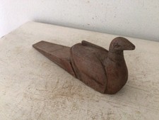 Alter geschnitzter Türstopper