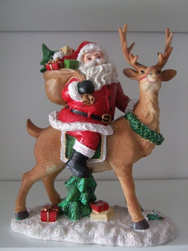 Weihnachtsmann auf rentier - weihnachtsmann,