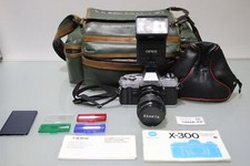 Minolta X-300 mit Exakta 35-70mm 1:3.5-4.8+ Carena CA21 Blitz + Tasche