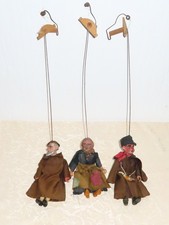 Drei antike Marionetten