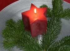 MIGROS Kerze sternform weinrot