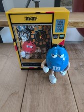 Coin bank mit uhr - m&m, u