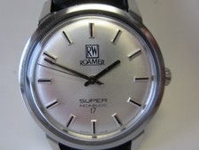 " ROAMER , RW , SUPER , HANDAUFZUG , EDELSTAHL , BAND  NEU ,"um 1972