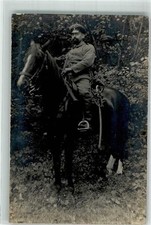 39803385 - Deutscher Kavallerist hoch zu Pferde in Uniform mit Schirmmuetze und