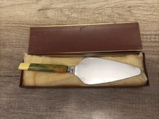 DDR Tortenheber mit mehrfarbigen Griff 