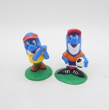 Dolfi Novotel Werbefigur 2 Stück Dolfi als Fußballspieler & Golfer Gummifigur