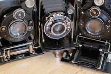 Drei alte Fotokameras