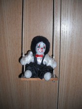 Harlekin auf Schaukel