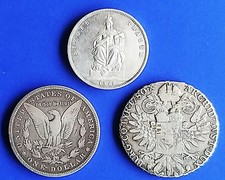 Drei alte Silbermünzen