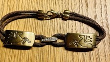 Armband . Pierre Lang . Goldfarben . Pferde. Braunes Leder. Top