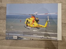 Bild auf Leinwand, Rettungshubschrauber über Meer