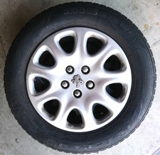 4X Winterreifen 205/65 R15 94H ca. 6mm Profil a. Stahlfelgen mit Peugeot-Kappen 