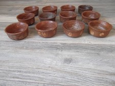 12 getöpferte Schalen   ca 10 cm Durchmesser ca. 4 cm hoch versch. brauntöne