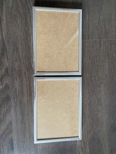 2 silberne Bilderrahmen