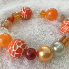 Sonderpreis  Armband Glas-, Keramik- und Acrylperlen in orange
