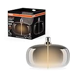 Osram Vintage 1906 Big Elipse ist eine dimmbare LED-Lampe mit Filament in Ellipsenform. Sie bietet 4 W für 60 lm, E27 Fassung, Smoke Design, 215 mm Durchmesser, Farbwiedergabe CRI 80, 1800 K.